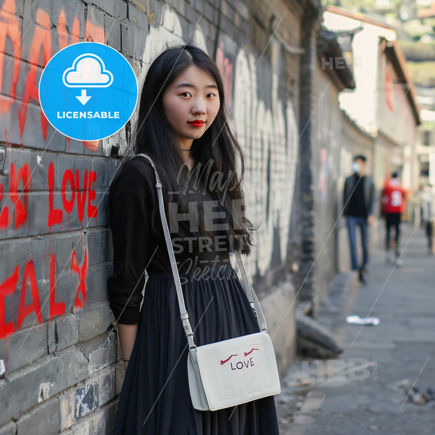 A Woman Leaning Against A Wall