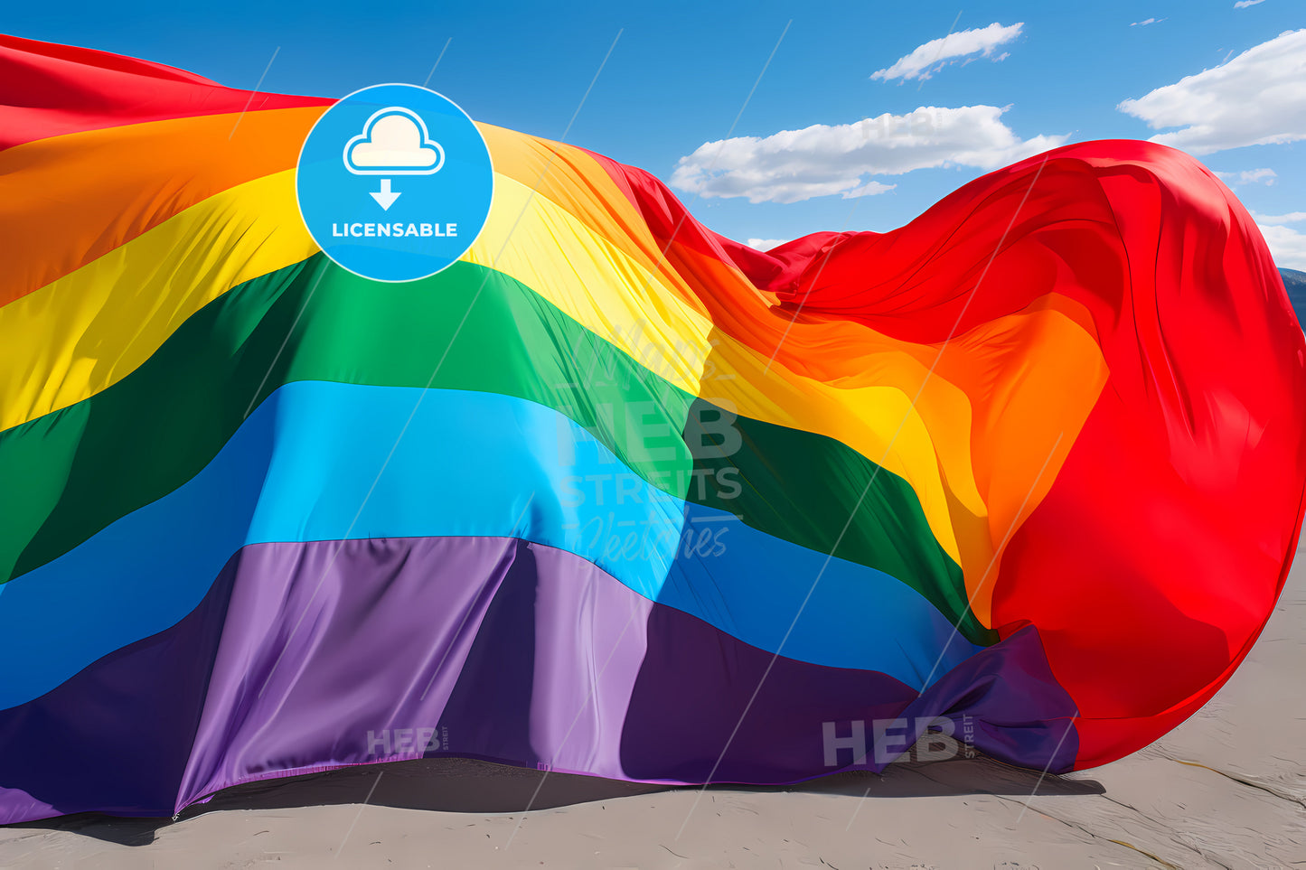 An Image Of A Rainbow Flag, A Rainbow Flag With Blue Sky And Clouds