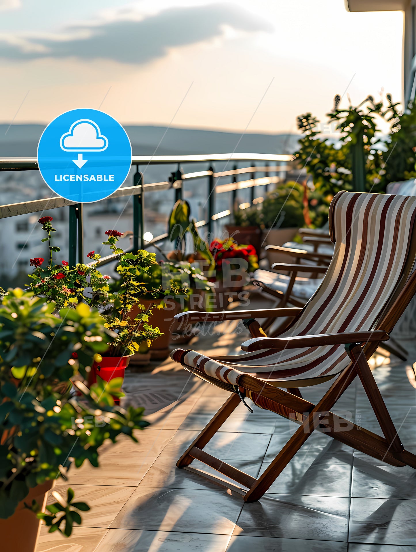 Small Patio With A Deck Chair, Chairs On A Balcony With Plants And A Railing