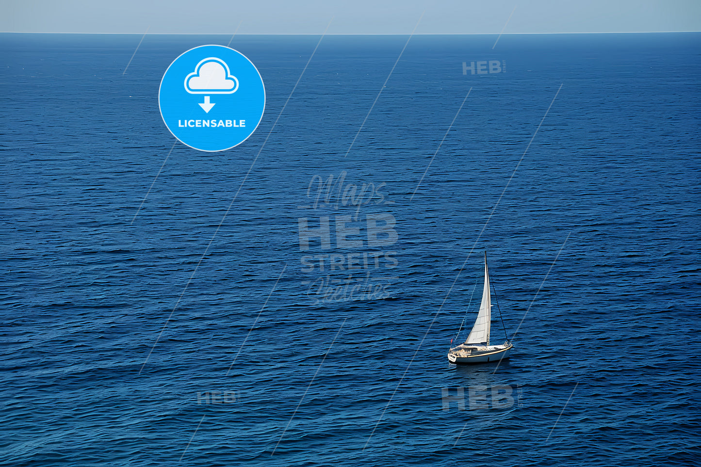An White Sailboat In The Wind, A Sailboat In The Ocean