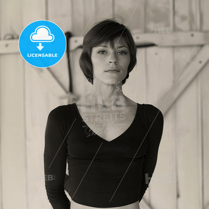 Nadia Comăneci, Born: 1961, Romanian gymnast - A Woman In A Black Shirt