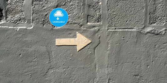 Artistic Arrow Symbol on Street Wall Mural with Vibrant Colors and Ample Space for Text